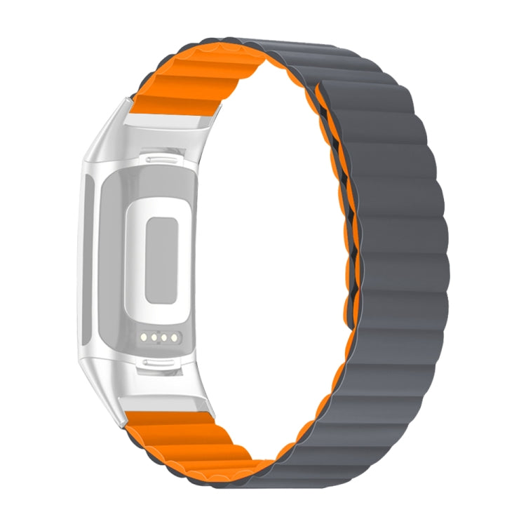 Silicone watch band with dark gray links and orange edge accents