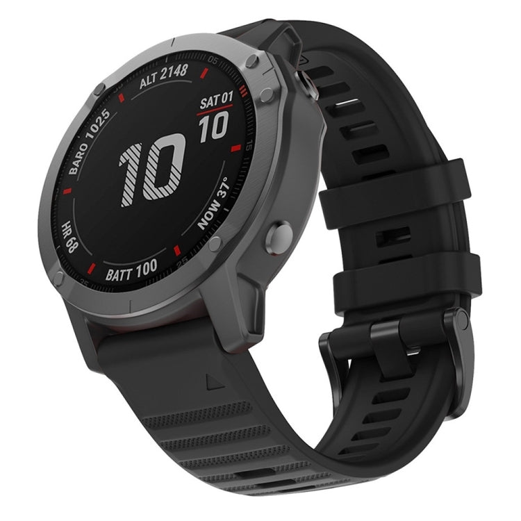 Black silicone watch band with adjustable buckle and textured strap holes.