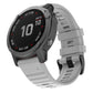 Gray silicone watch band with adjustable buckle and textured strap holes.