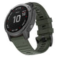Dark green silicone watch band with adjustable buckle and textured strap holes.