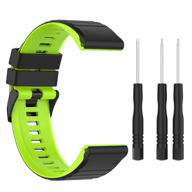 Two-tone silicone watch band with lime green strap and black underside, plus pins