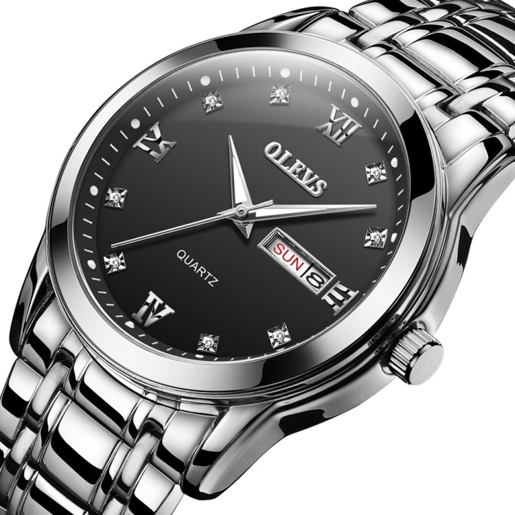 Men's OLEVS quartz watch angled close-up, black dial, date window at 3 o'clock.
