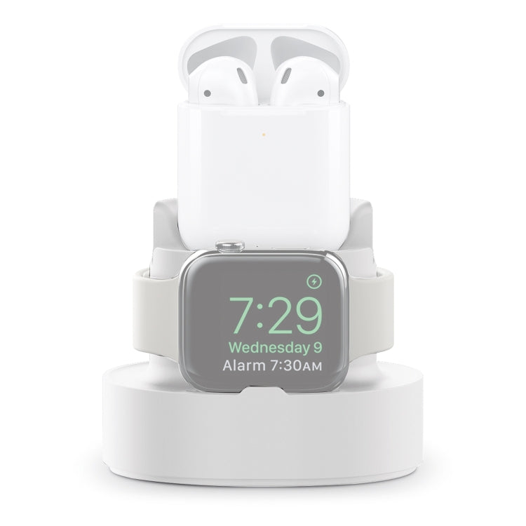 Three-in-one charging holder in white with AirPods case and Apple Watch display