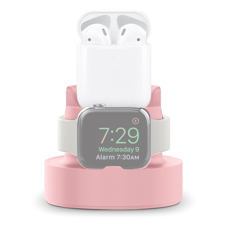 Three-in-one charging holder in pink with AirPods case and Apple Watch on stand