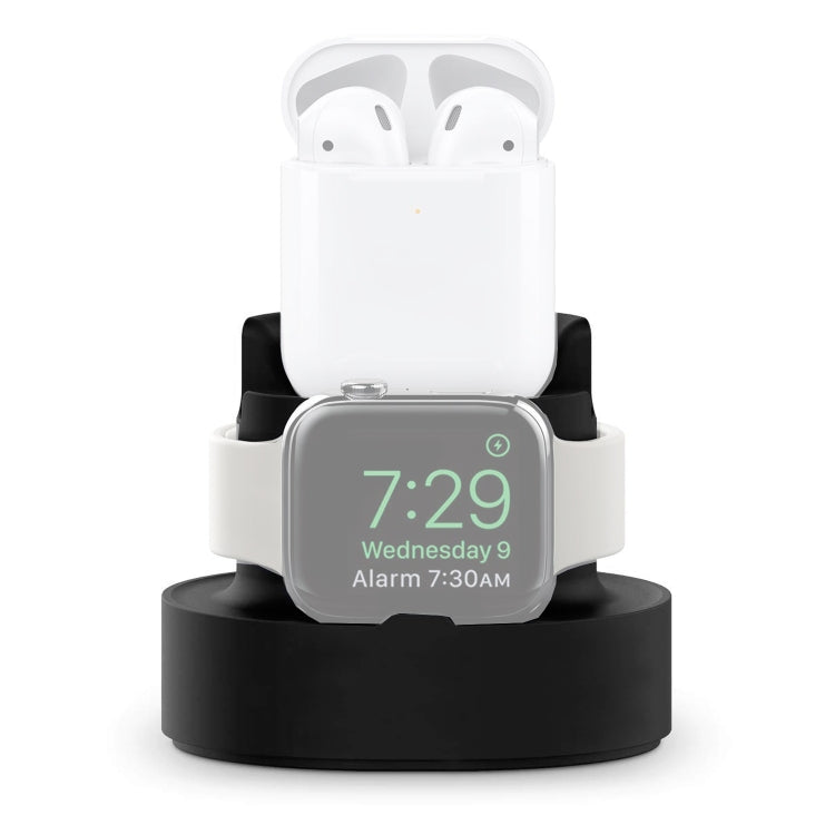 Three-in-one charging holder with dark base, AirPods case, and Apple Watch display