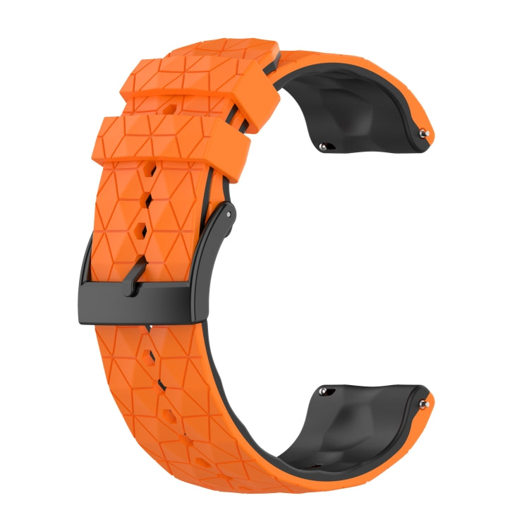 Two-tone silicone watch band with bright orange top and black underside, geometric pattern