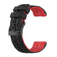 Two-tone silicone watch band with black top and red underside, geometric texture