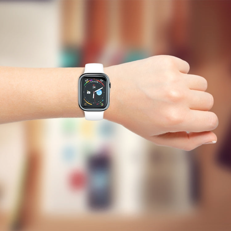 Black protective watch case on wrist with cutouts for screen and side controls