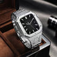 Silver metal watch with black textured dial and integrated link bracelet, angled view