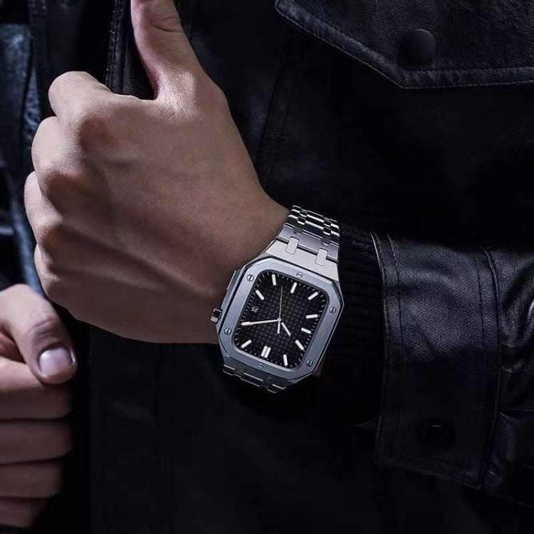 Metal link watchband on wrist with black dial, octagonal case, baton markers