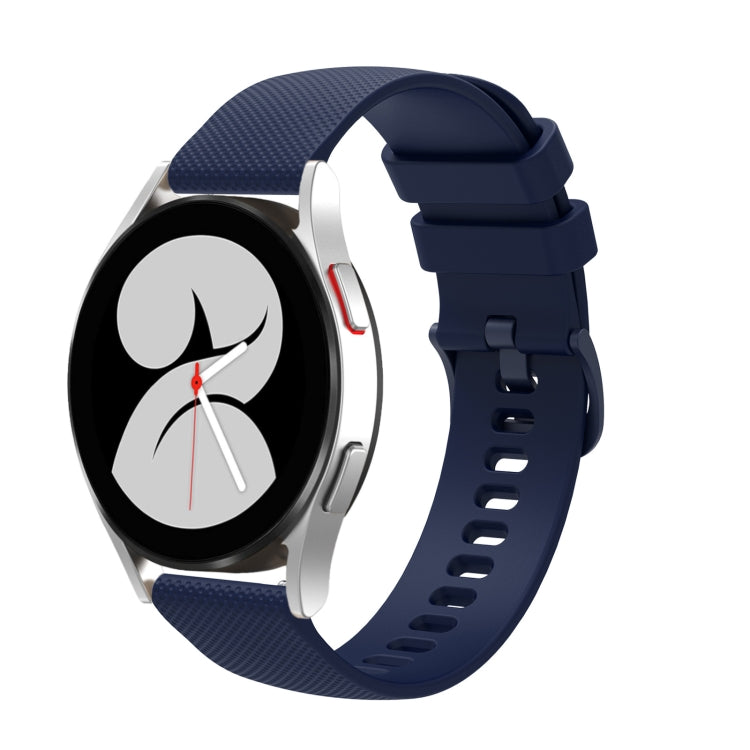 Navy silicone watch strap with tonal pockmarked texture, buckle clasp and strap holes