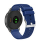 Silicone watch strap with textured pockmarked surface and silver buckle, blue band