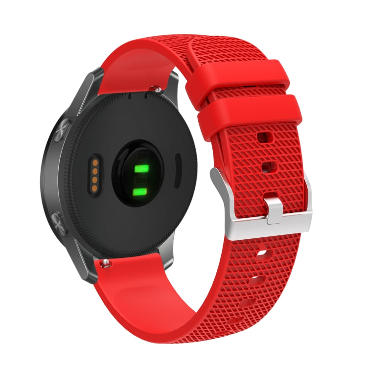 Silicone watch strap with textured pockmarked surface and silver buckle, red band