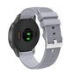 Silicone watch strap with textured pockmarked surface and silver buckle, gray band