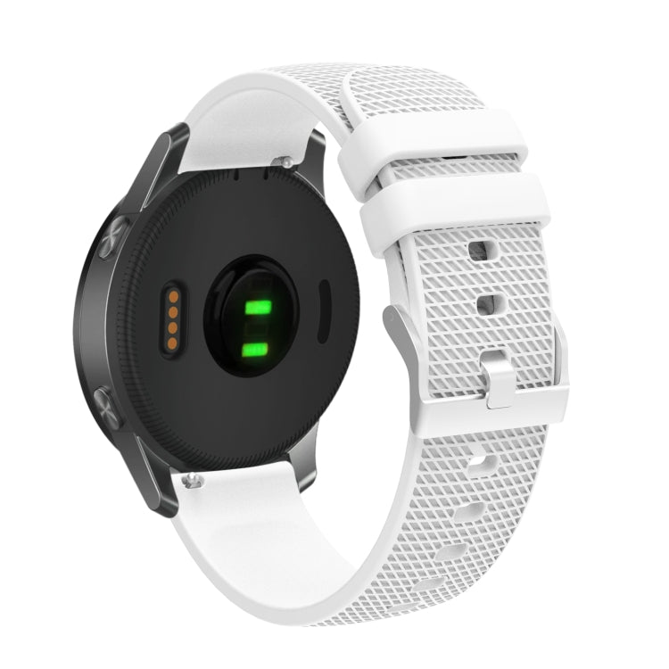 Silicone watch strap with textured pockmarked surface and silver buckle, white band