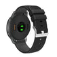 Silicone watch strap with textured pockmarked surface and silver buckle, black band