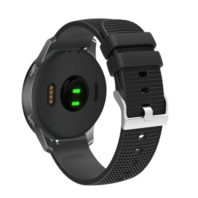 Silicone watch strap with textured pockmarked surface and silver buckle, black band