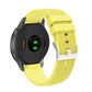 Silicone watch strap with textured pockmarked surface and silver buckle, yellow band