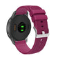 Silicone watch strap with textured pockmarked surface and silver buckle, burgundy band