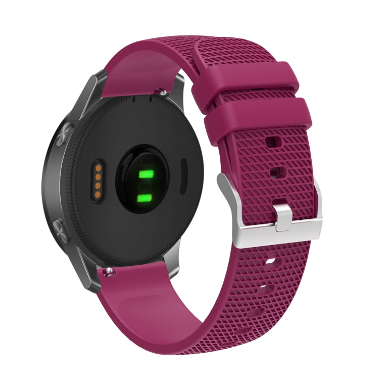 Silicone watch strap with textured pockmarked surface and silver buckle, burgundy band