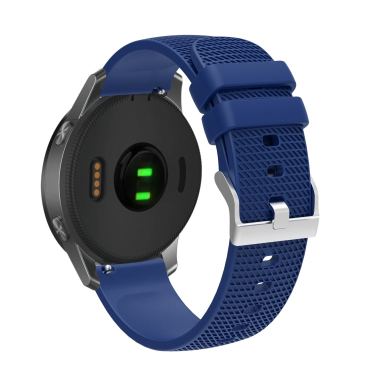 Silicone watch strap with textured pockmarked surface and silver buckle, navy blue band