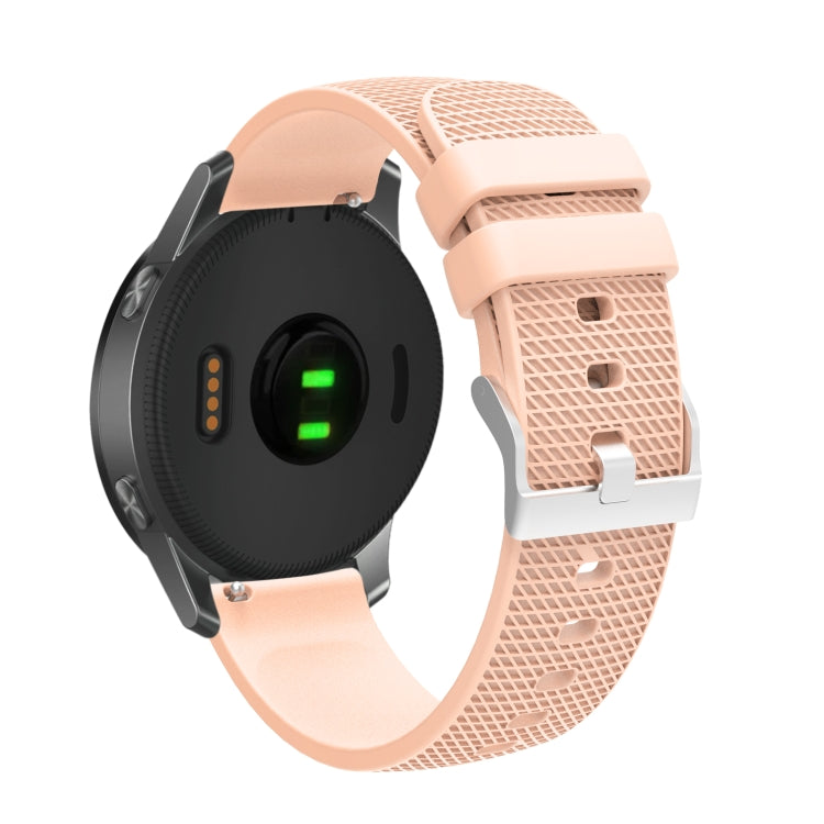 Peach pockmarked silicone watch strap with silver buckle, perforated texture