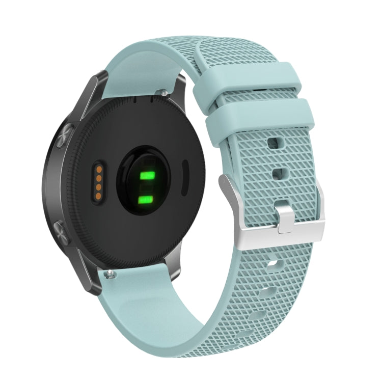 Light blue silicone watch strap with silver buckle and pockmarked perforations