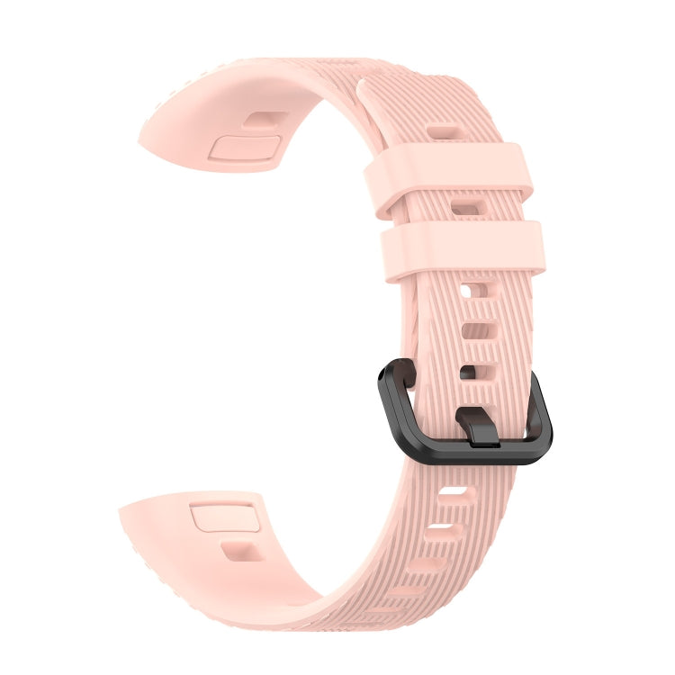 Pink silicone watch strap with ridged texture and adjustable buckle