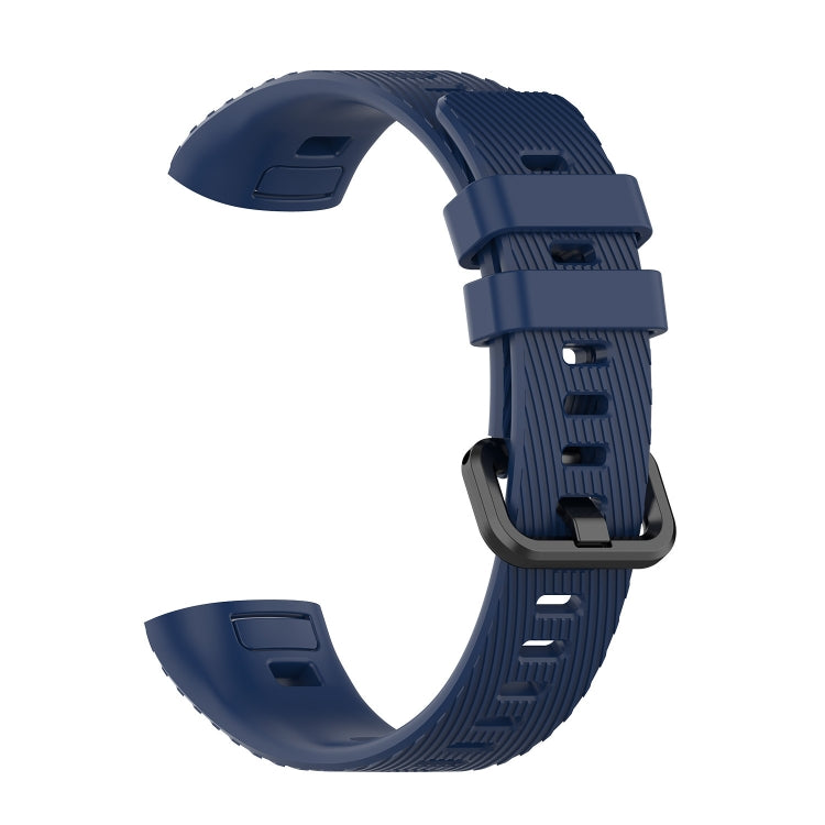 Navy blue silicone watch strap with ridged texture and adjustable buckle
