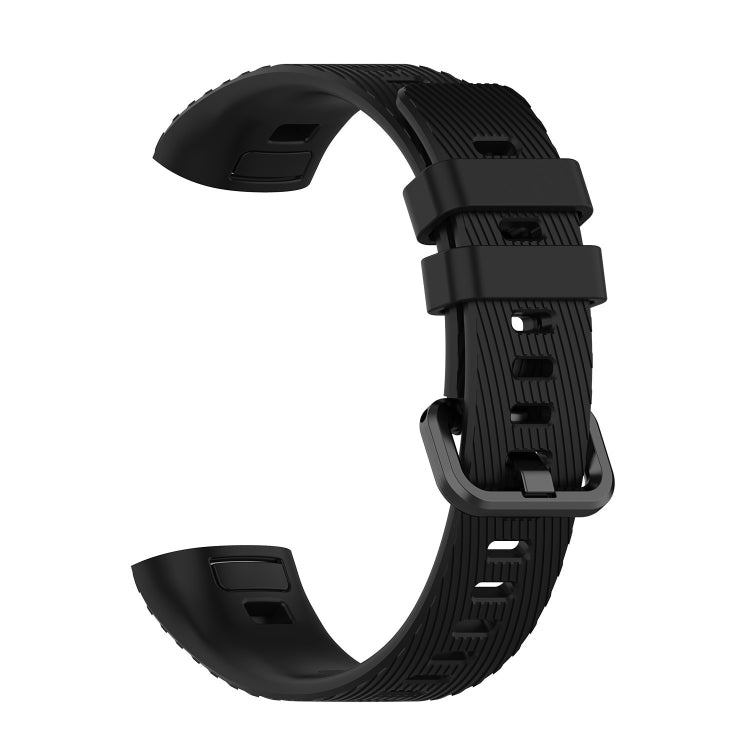 Black silicone watch strap with ridged texture and adjustable buckle