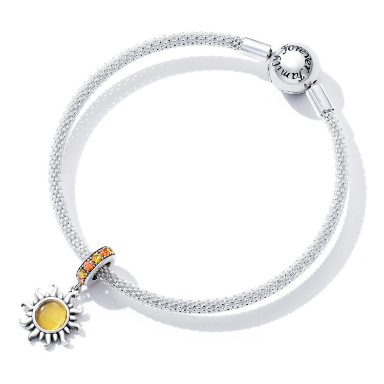 Sterling silver mesh bracelet with sun charms and an orange crystal accent bead