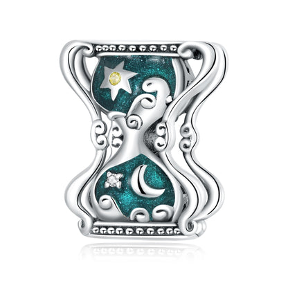 Sun and moon hourglass charm bead with teal enamel, star and crescent, silver frame