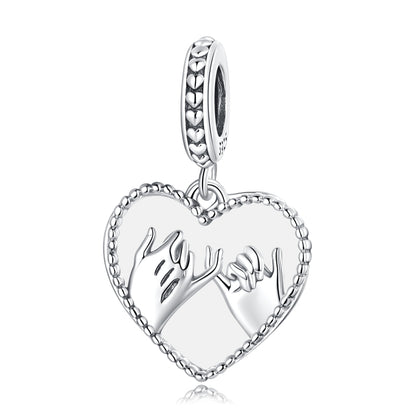 Heart charm pendant in sterling silver, hand-swearing hands motif