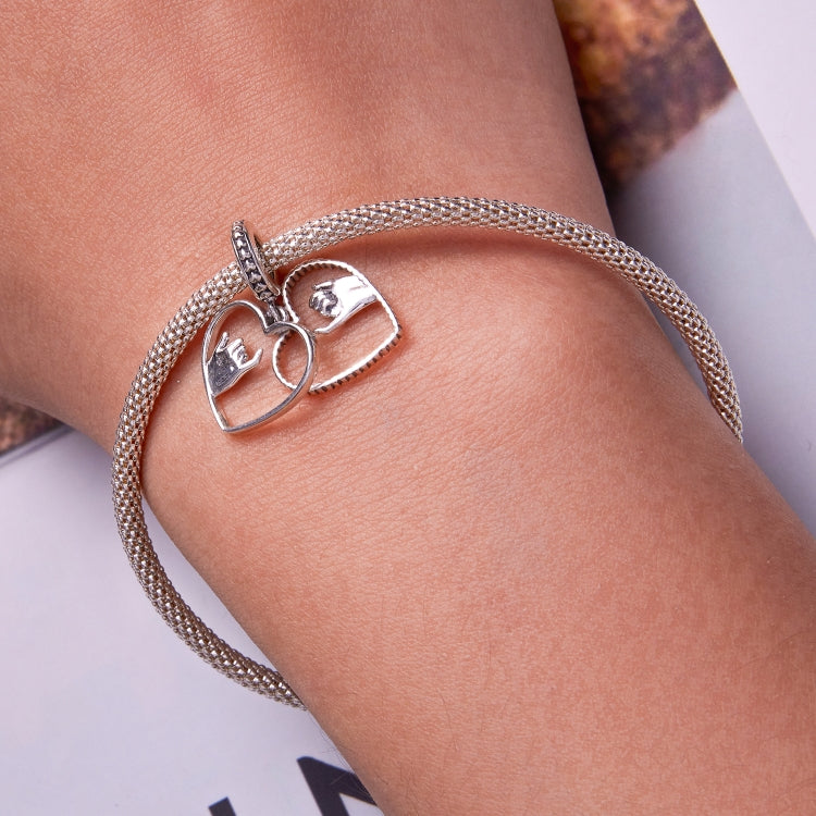 Sterling silver mesh bracelet with heart charms featuring hand-swearing hands motif