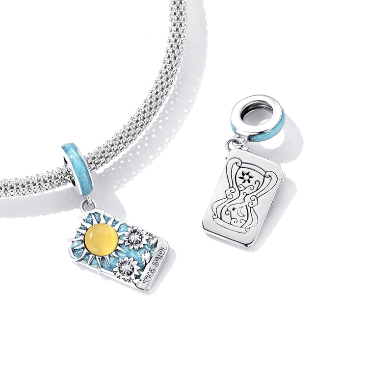 Sterling silver bracelet charm with tarot card sun motif, blue enamel and yellow sun on chain
