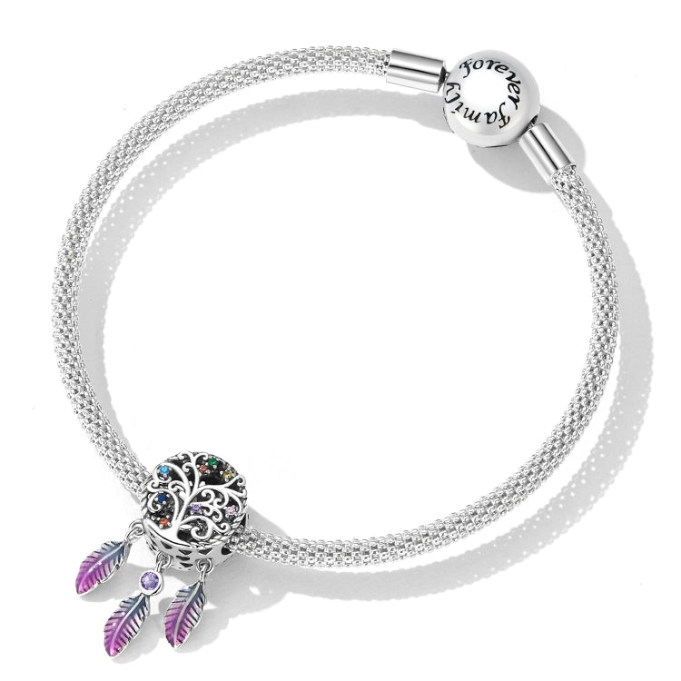 Sterling silver charm bracelet with round dreamcatcher bead and dangling purple feather charm.