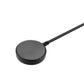 Black charging puck contact disk on end of charging cable
