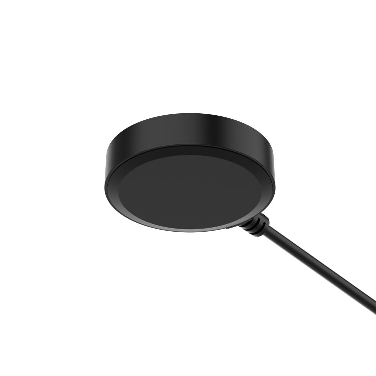Round black charging dock with attached cable