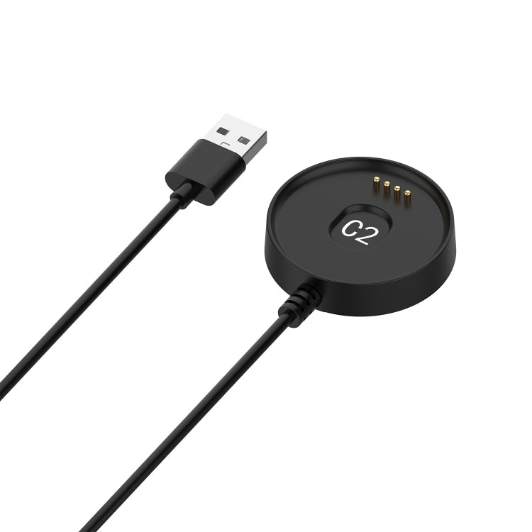 Black charging dock puck with G2 text, gold contacts, and USB-A connector
