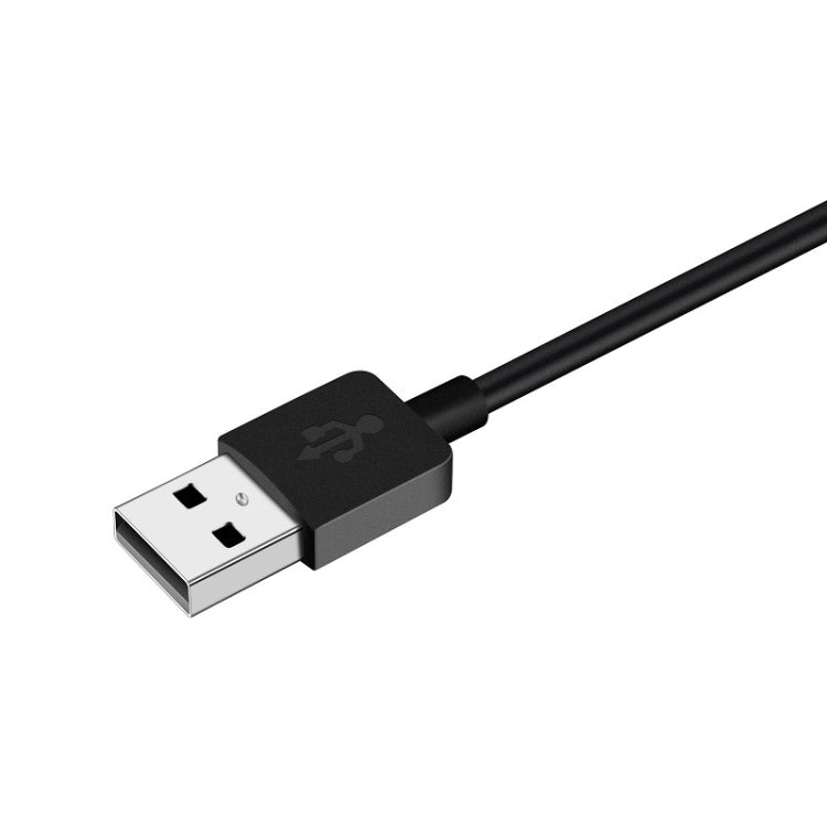 USB-A charging plug on a black smart watch magnetic cable