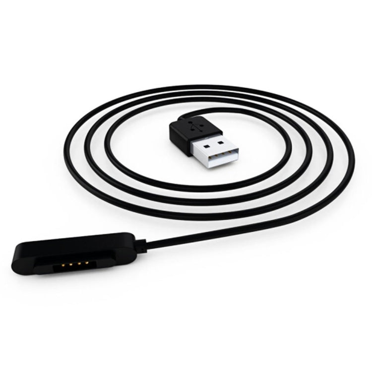 Coiled black charging cable with USB connector and watch charging dock