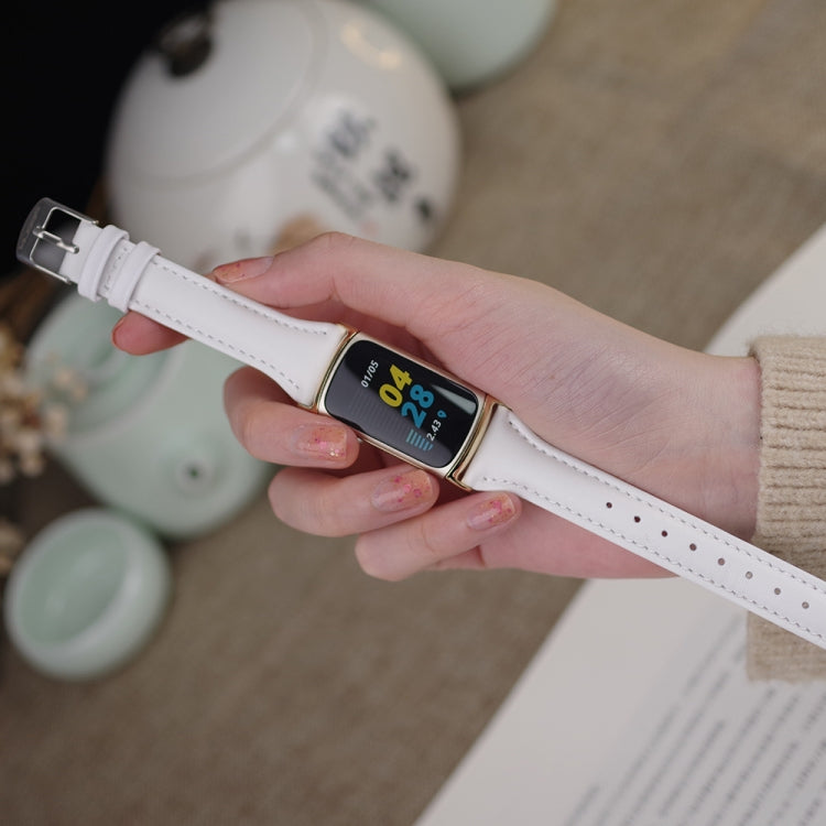 White leather slim watch band with gold buckle on wrist for Fitbit Charge 5