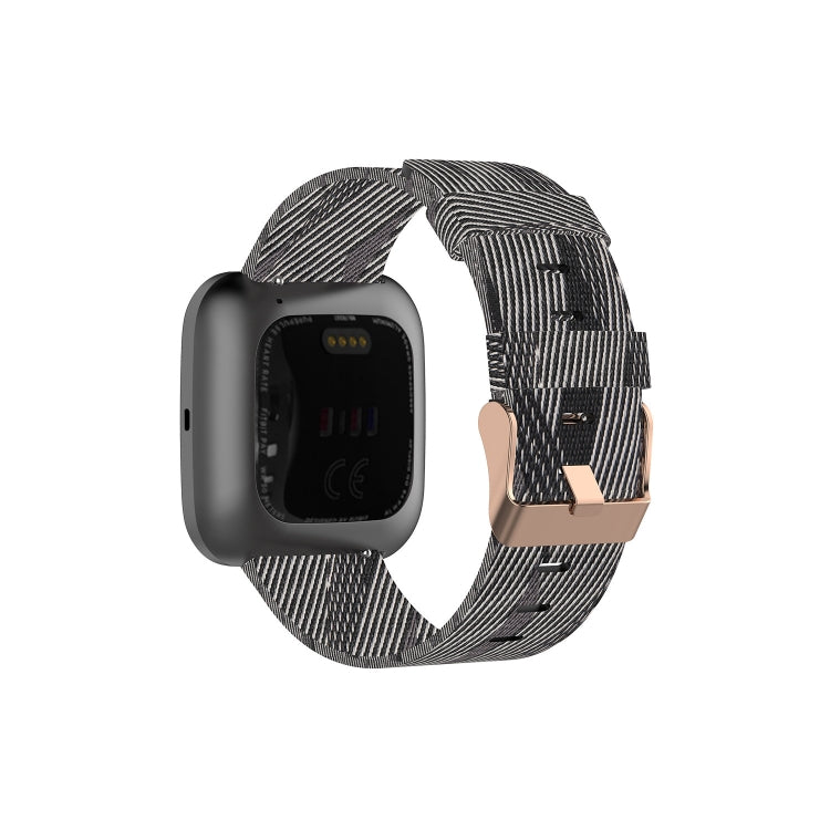 Canvas watch strap in black with white stripe pattern and metal clasp