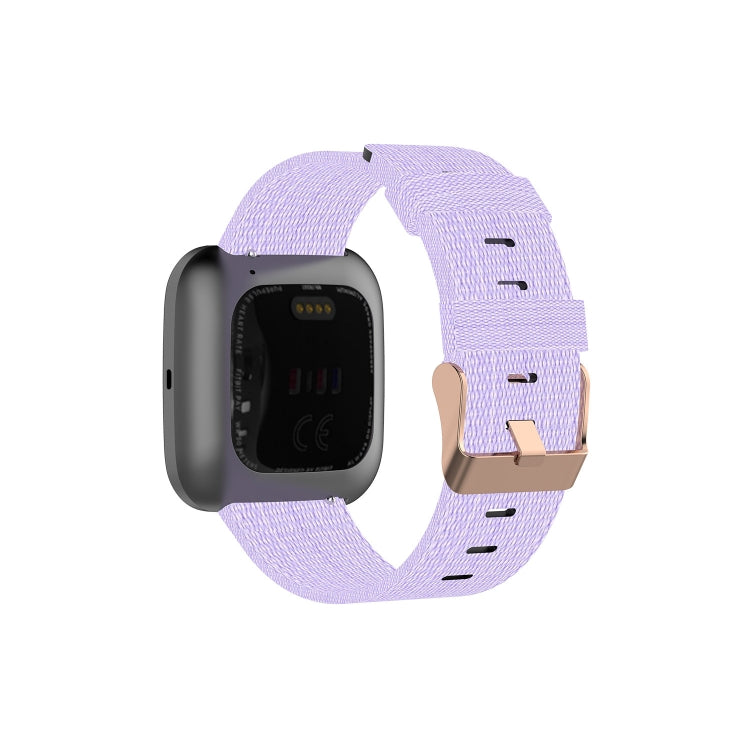 Canvas watch strap in light purple with dark stitch holes for a smartwatch