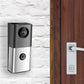 Outdoor wireless video doorbell unit on wall, black and silver with bell icon