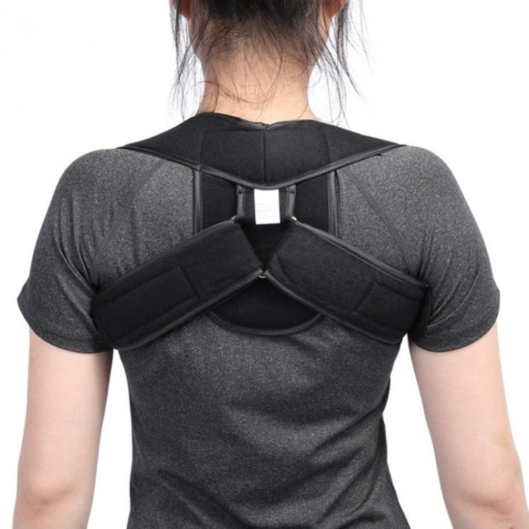 Children’s posture corrector with black back pad and padded cross straps