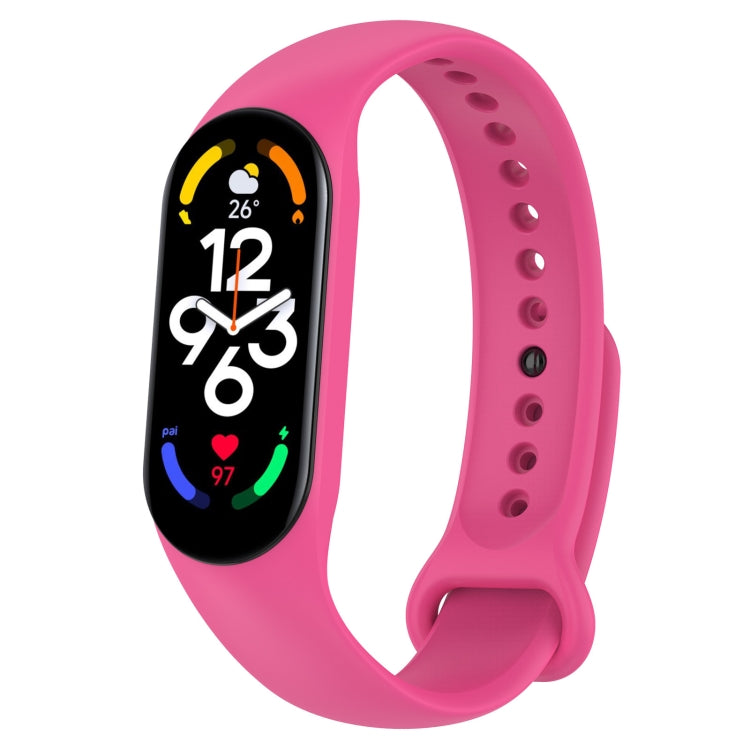 Pink silicone smartwatch band with oval fitness display and perforated strap holes