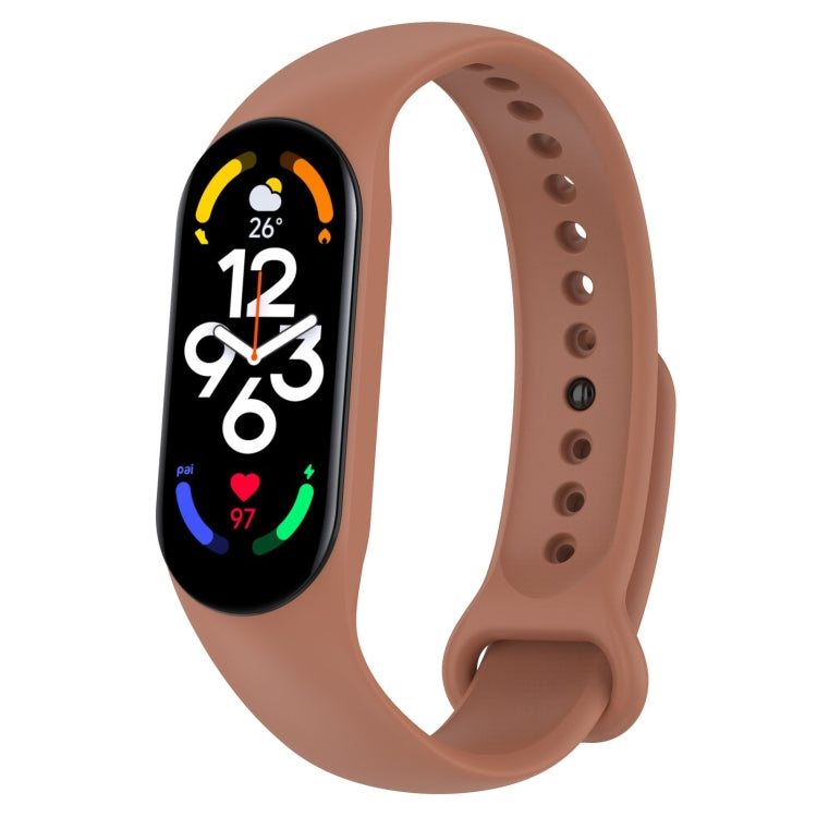 Tan silicone fitness watch band with perforated strap and oval display