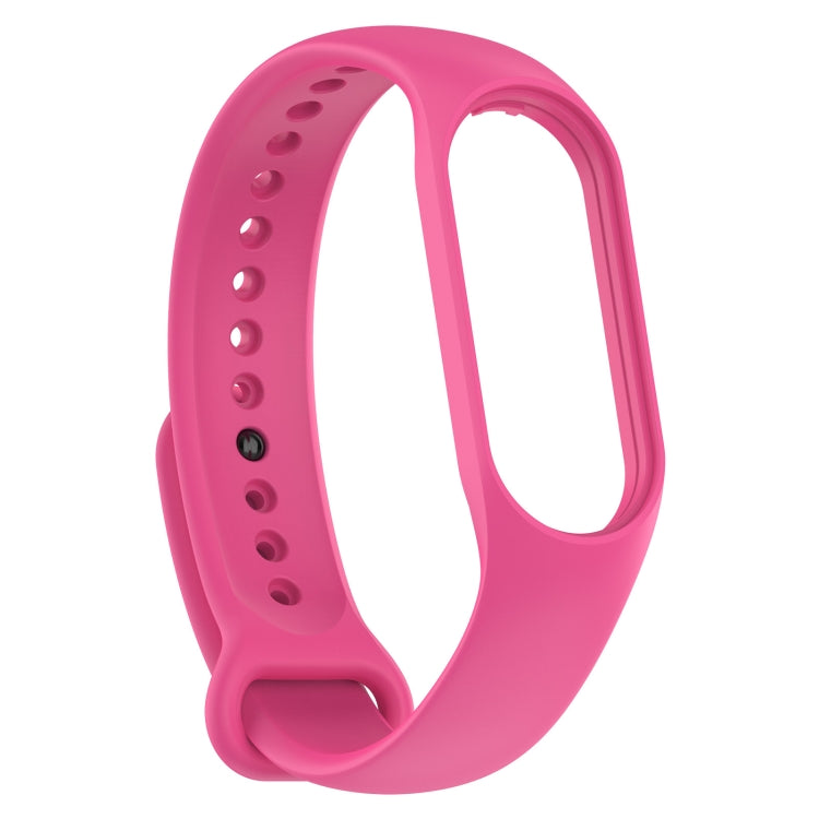 Pink silicone smartwatch band shown from the side with strap pin holes