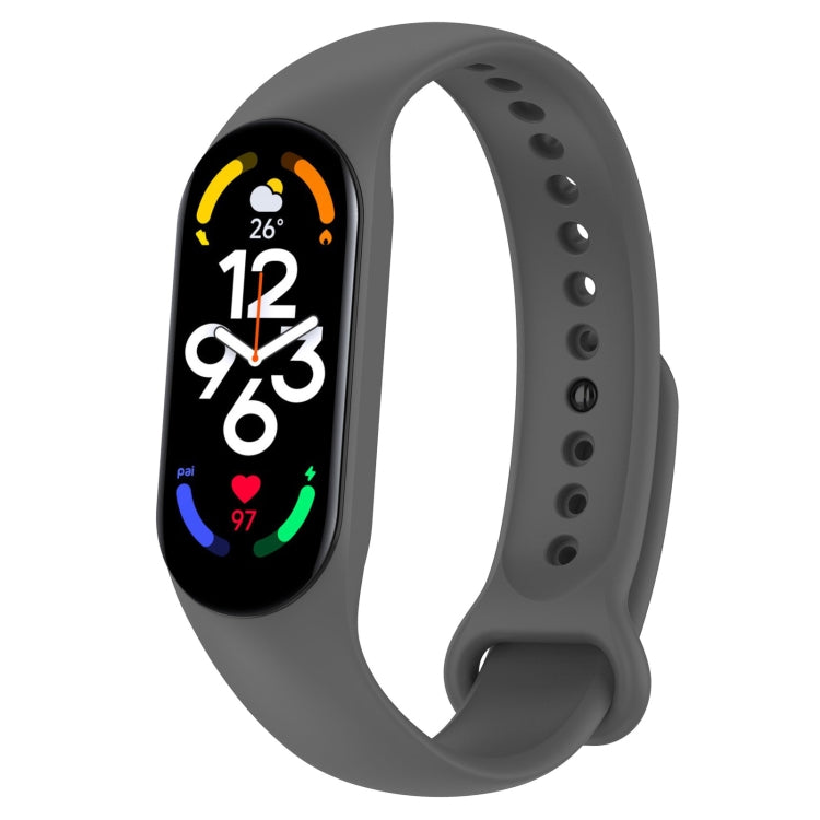 Dark gray silicone smartwatch band with oval fitness screen and side pin holes